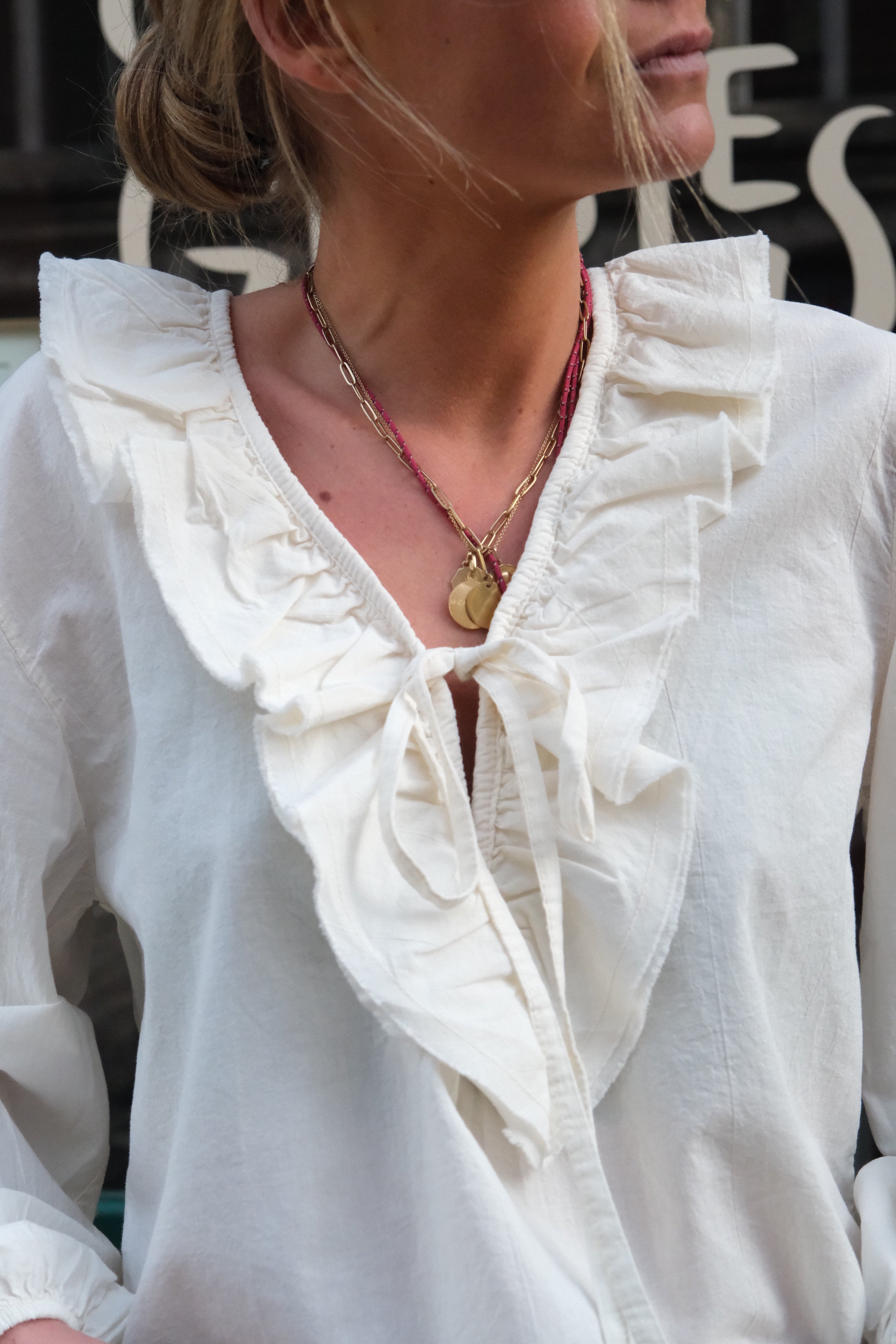 Sidonie ecru ruffle neckline blouse